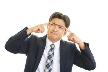 頭痛を訴えるビジネスマン