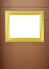 blank golden frame on cement wall