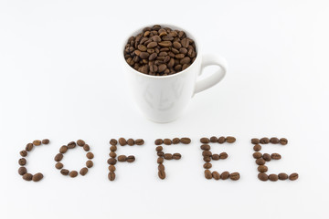 Roasted coffee beans in a cup with name