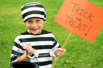 Young Child Dressed in Halloween Costume Trick-or-Treating