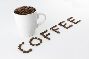 Roasted coffee beans in a cup with name