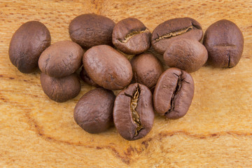 roasted coffee beans on rustic wood