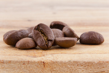 roasted coffee beans on rustic wood