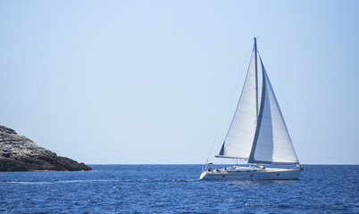 Obraz premium Sailboat trip on sea. Luxury yachts, sea voyages.