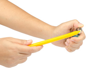 Lighter and candle in woman's hand