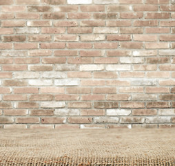 Sackcloth over table and brick wall, background, template