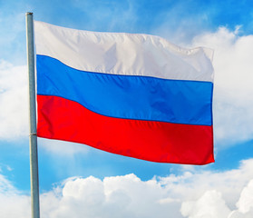 Fototapeta na wymiar Russian flag waving in the wind over sky