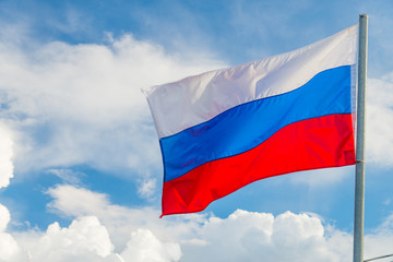 Fototapeta na wymiar Russian flag waving in the wind over sky