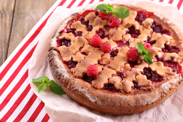Tasty cake with berries on table close-up