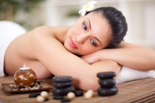beautiful woman relaxing in spa center