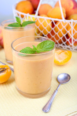 Apricot dessert in glasses on table close-up
