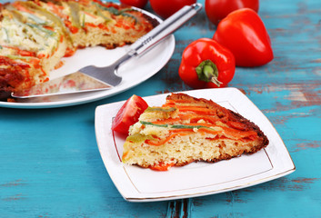 Casserole with vegetables on plate on table close-up