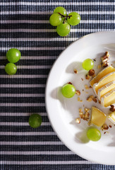 tasty salad with grape and cheese, close up