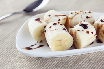 Chopped bananas with chocolate sauce