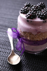 Healthy breakfast - yogurt with  blackberries and muesli served