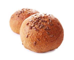 Tasty  brown buns with sesame isolated on white