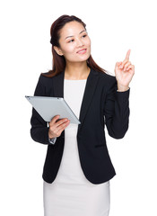 Asian businesswoman hold tablet and finger point up