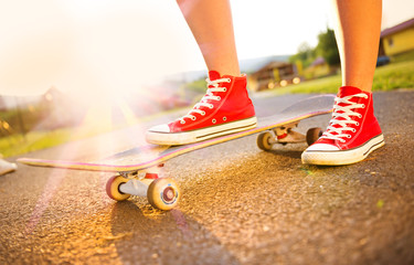 Female feet on skateboard