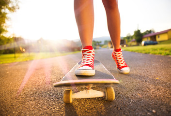 Female feet on skateboard