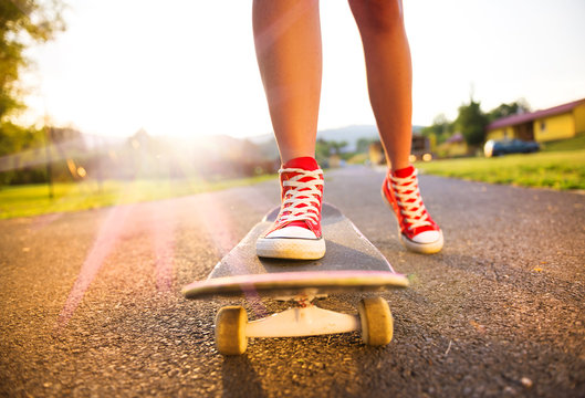 Female feet on skateboard