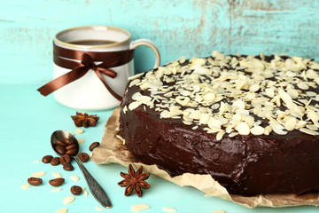 Tasty chocolate cake with almond, on old wooden table