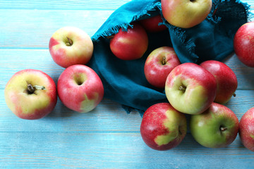 Juicy apples on wooden table, close-up