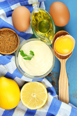 Mayonnaise ingredients on wooden background