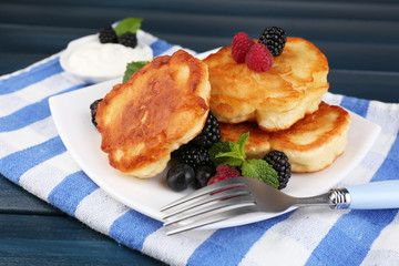 Tasty pancake with fresh berries and mint leaf