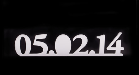 Date on a black background.