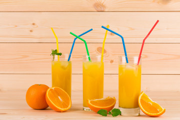 Orange juice on wooden table.