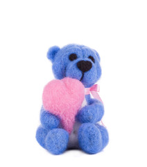 Soft toy teddy with heart.