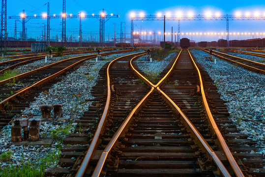 Fototapeta Cargo train platform at sunset with container