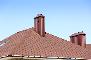 New tiled roof with chimneys