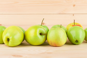 Ripe apples on wood table.