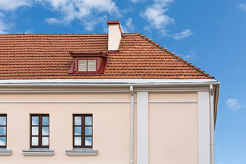 House roof with chimneys and dormer