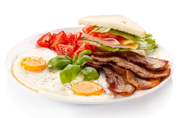 Breakfast - toast, egg, bacon and vegetables