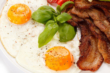 Breakfast - toast, egg, bacon and vegetables