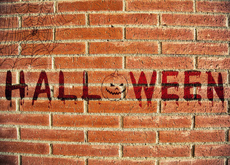 Halloween text on brick wall