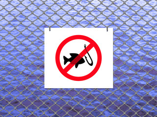 Mesh fence the river with signs prohibiting fishing