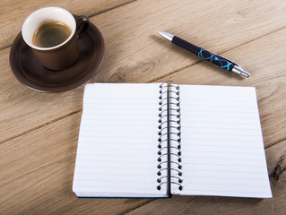 Coffee cup and notebook