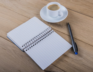 Coffee cup and notebook