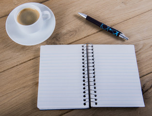 Coffee cup and notebook