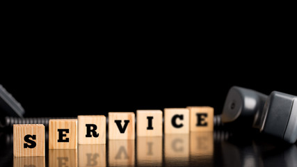 The word Service on wooden blocks