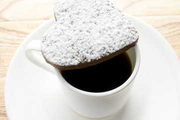 Chocolate heart cookies in powdered sugar