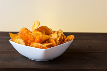 Potato chips bowl on table