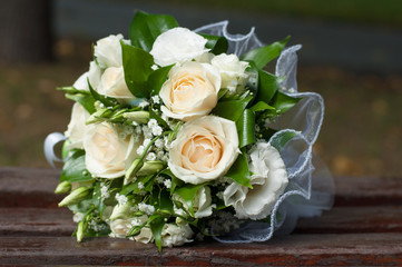 Bridal bouquet of roses and green leaves