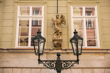 sculpture and street lighter in Prague