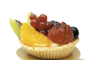 Custard pie with mixed fruits isolated on the white baclground