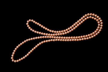 Lily-shaped necklace over black