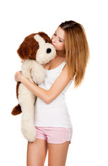 Beautiful girl hugging a teddy dog